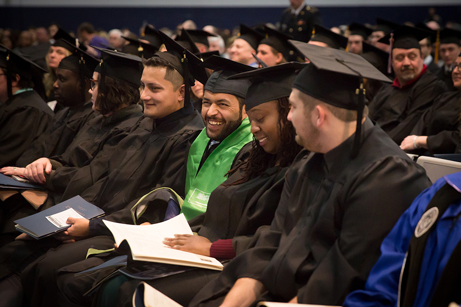 Students enjoy a laugh during one of Saturday’s commencement ceremonies.