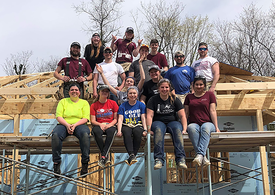 Nilu Umarova, front row right, helps build a home in North Carolina in 2019 with UW-Stout’s student chapter of Habitat for Humanity.