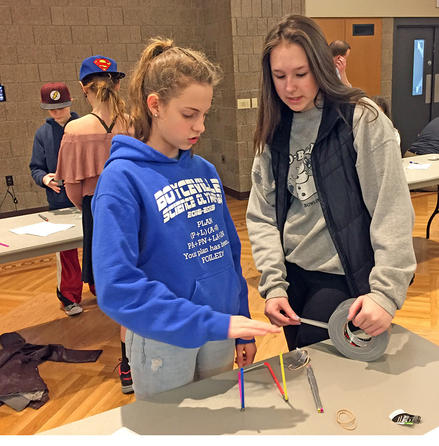 Boyceville Middle School students Mariah Marvin, at left, and Andrea Jensen found creating a drinking straw catapult more difficult than they thought but enjoyed the project at the Stout Expo.