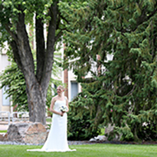 A bride standing in the Arboretum at UW-Stout.