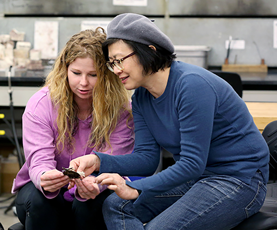 Mindy Allee and Associate Professor Masako Onodero talk about Allee's brooch.