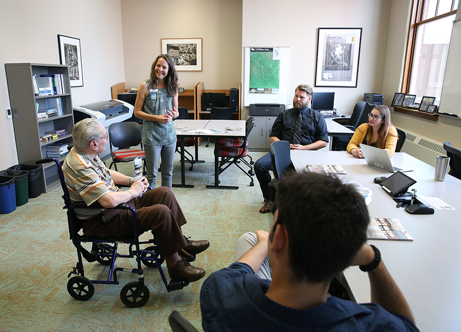 Retired UW-Stout faculty member Lee Smalley, at left, talks about the Social Science Research Center with Tina Lee, applied social science program director, and students Ryan Leckel, Elle Alvarez and Frank Janovec. One of the goals of the Social Science Research Center is to become a regional think tank, working with community partners to provide research to improve the quality of life in the area.