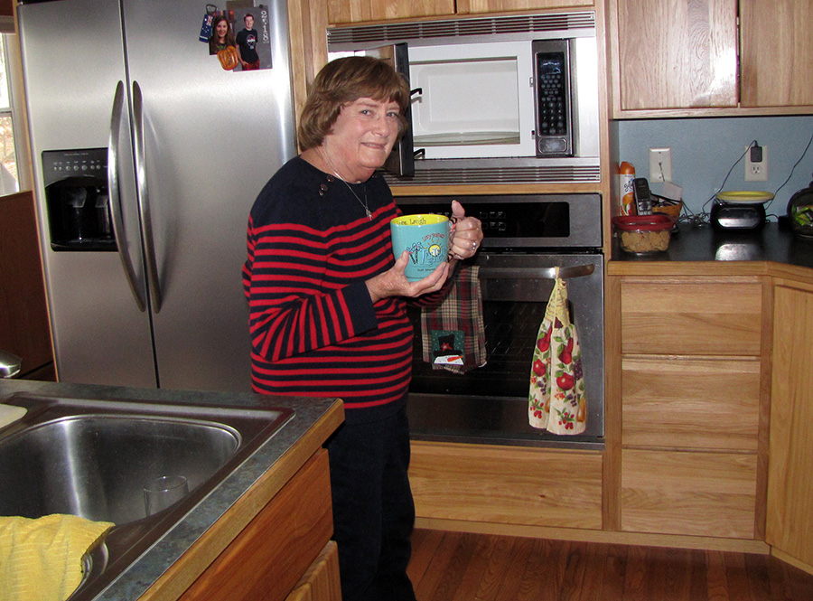 Lynn LaVenture makes a cup of tea at her Menomonie home. She is one of nearly 100,000 people on a kidney transplant waiting list.