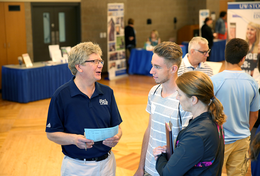 First-year student Burke Anderson says UW-Stout feels like home to him and that is why he chose to attend the university. Anderson talks with UW-Stout sports information director Layne Pitt at the resource fair.