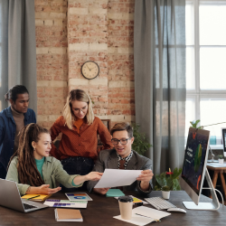 A team at a desk planning and strategizing 