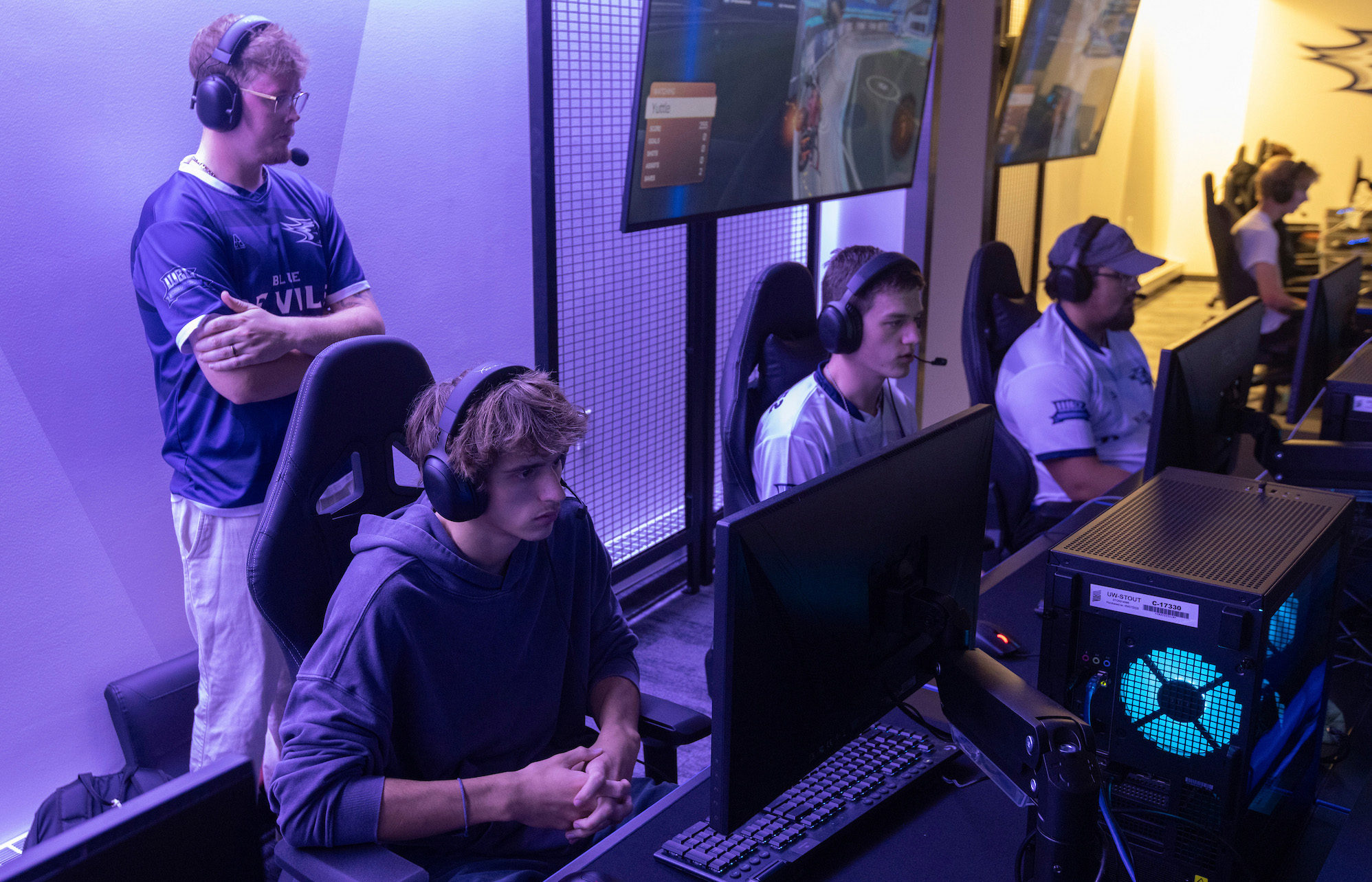 UW-Stout esports athletes compete in Rocket League while Coach Froelich eyes strategy.