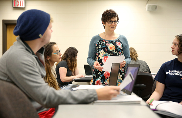 Amanda Barnett works with students in a Family Policy class at UW-Stout.