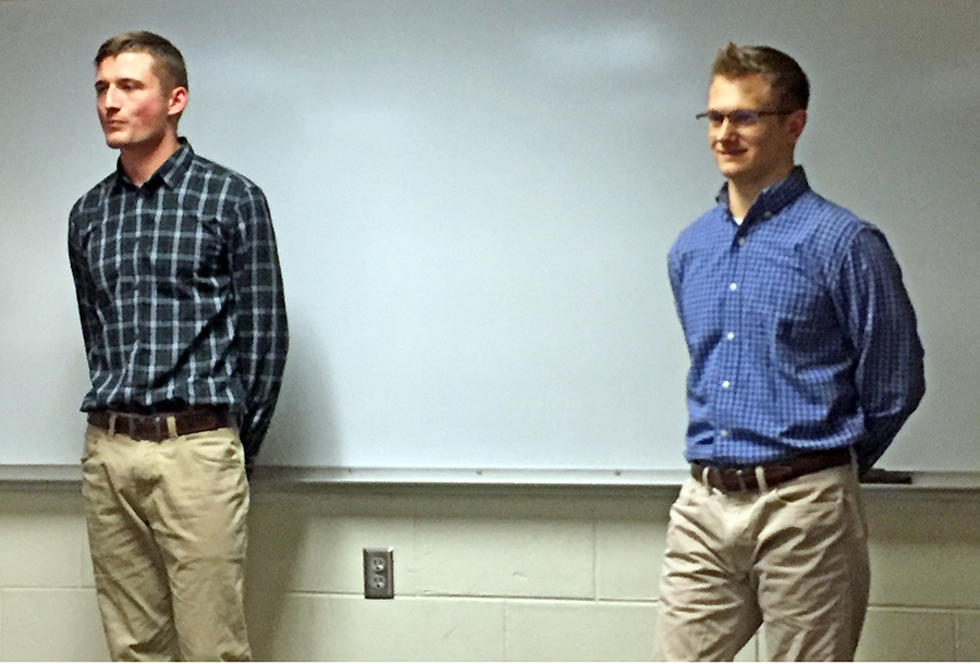 UW-Stout students Brad Osatiuk, at left, and Cam Ambrust talk about the custom controls and processing business they plan to start after they graduate in December.