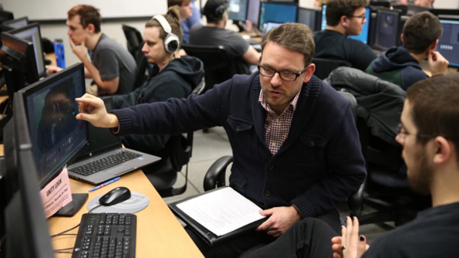 Dave Beck works with game design and development students.