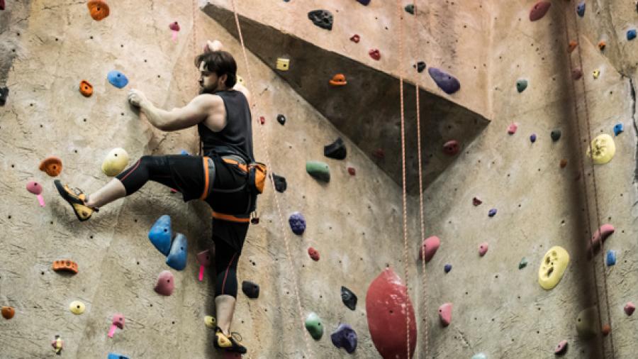 A UW-Stout student goes up the Stout Adventures climbing wall.