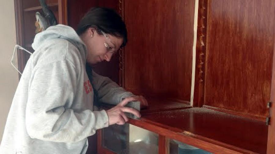University of Wisconsin-Stout construction major Mikayla Bartlett works on an electrical project at her family home in Rockford, Minn. 