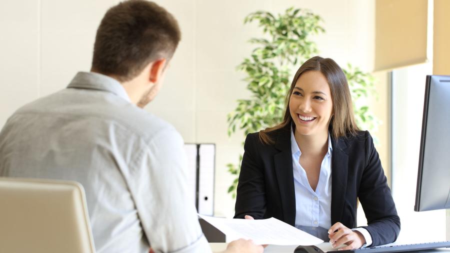 Photo of woman talking to new employee