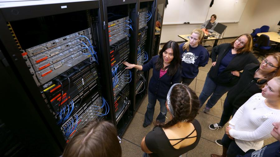 Professor Holly Yuan instructs students in a computer networking lab at UW-Stout.