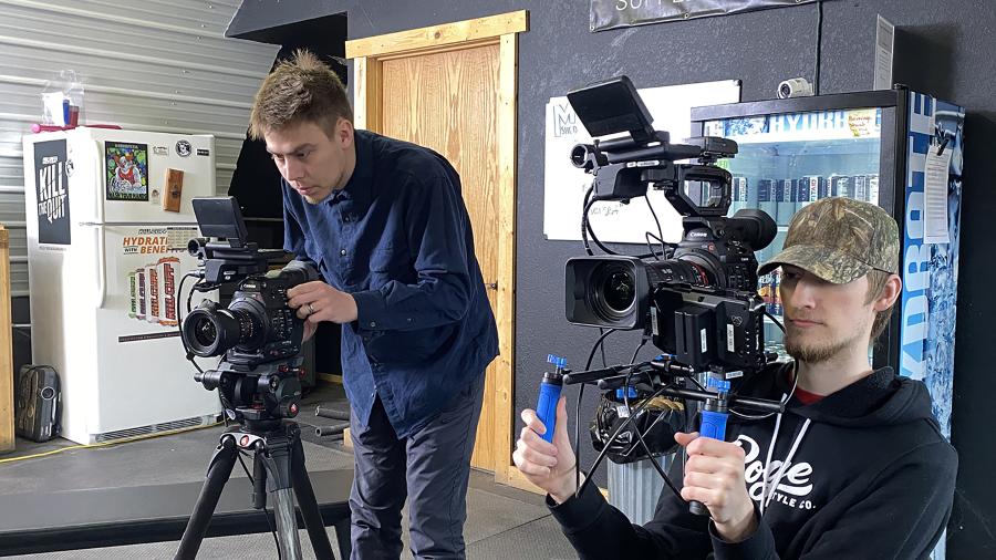 Video production majors Dimitri Luna, left, and Colin Podborny, film during their five-person team’s Project Hope effort