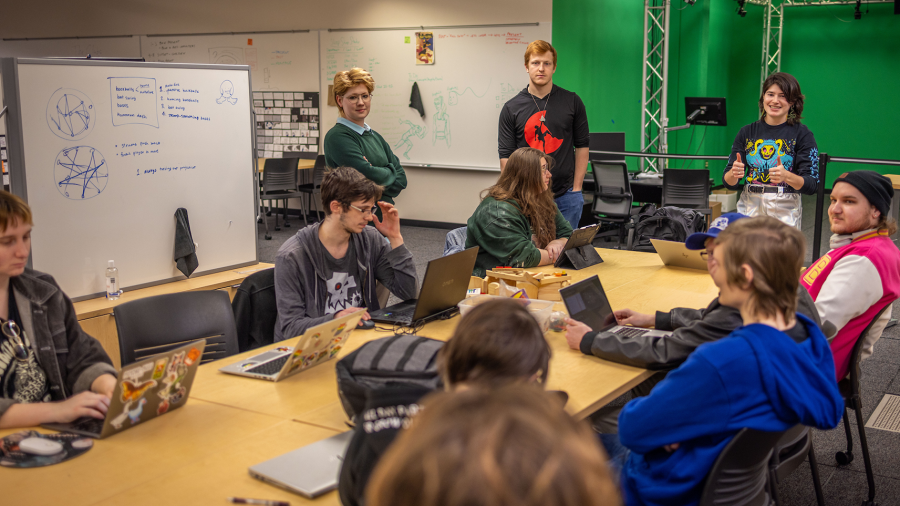 Students strategize and plan the development of a new video game.