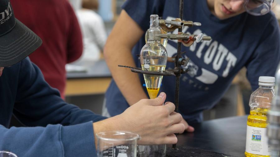 Honors Chemistry students combust canola oil samples to test their reactions