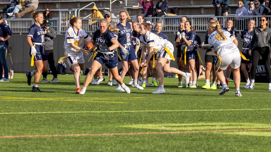Blue Devil Anna Mutch runs the ball during the inaugural Midwest College Women’s Flag Football League Championship.