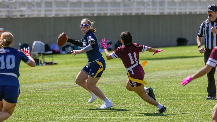 Quarterback Allison Letcher readies to throw a pass during the inaugural Midwest College Women’s Flag Football League Championship.