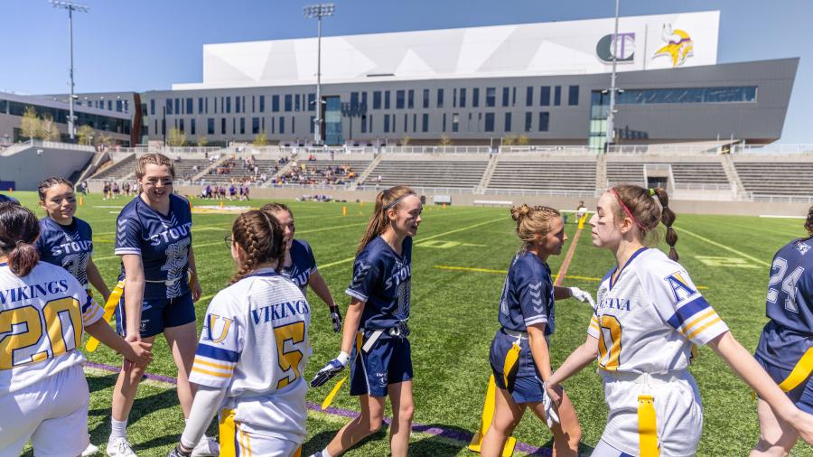 UW-Stout Blue Devils greet the Augustana Vikings during the inaugural Midwest College Women’s Flag Football League Championship.