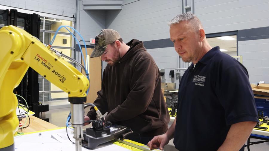 Jason Solberg and a student in an automation lab