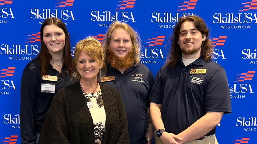 Four people pose together