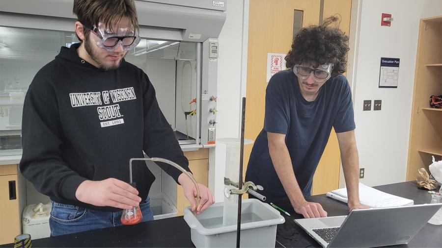 Honors chemistry students conducting an antacids experiment