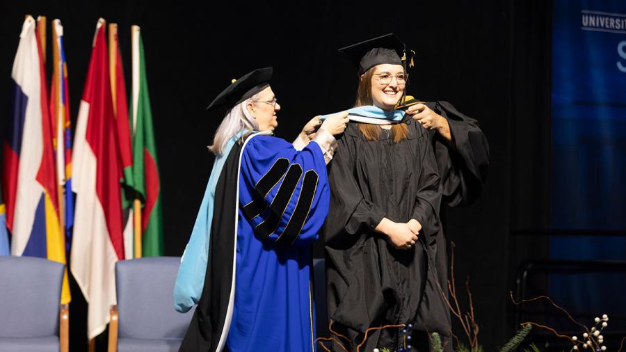 Woman gets graduate hood