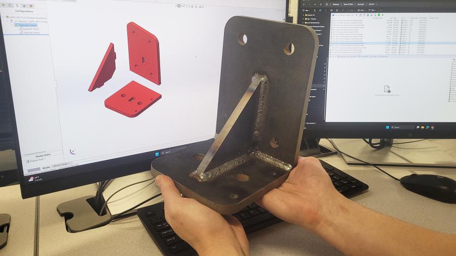 A side-by-side comparison of a digital model and a welded gusset