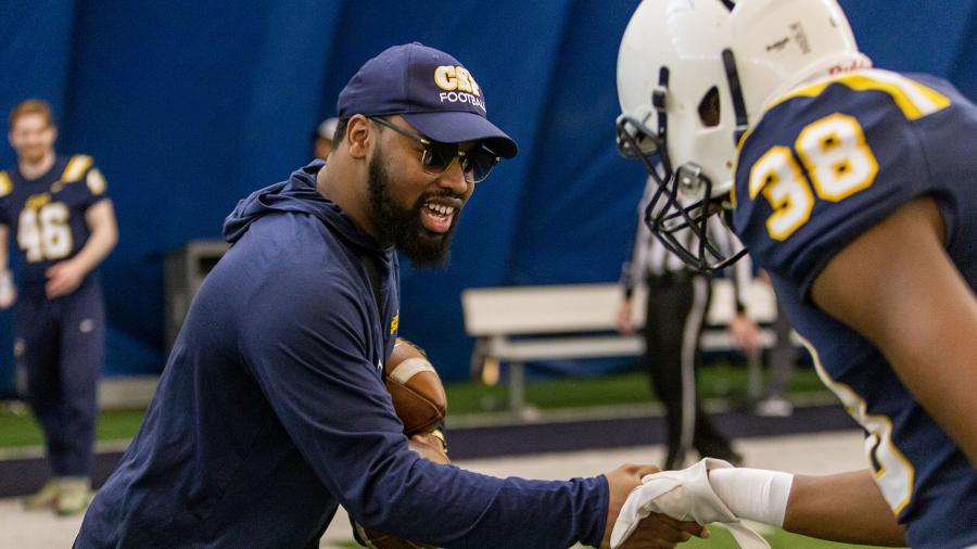 Mike Bond coaching student athlete