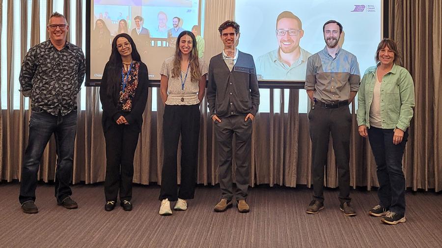 People in front of a projection screen