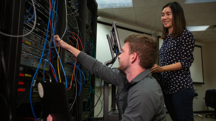 Two people and computer server