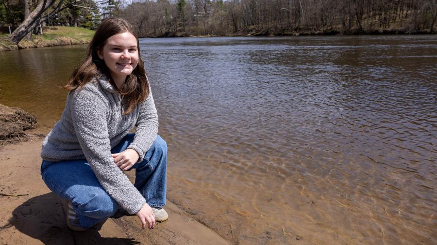 Woman next to river