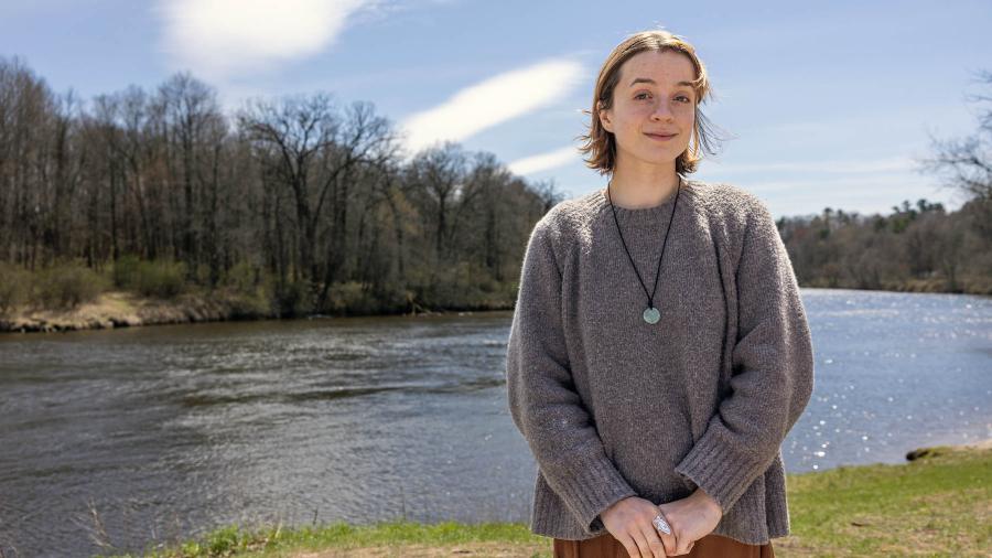Woman standing by river