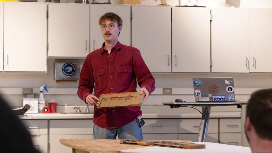 Jace Johnson presents his prototype for a music creating machine during a class critique.