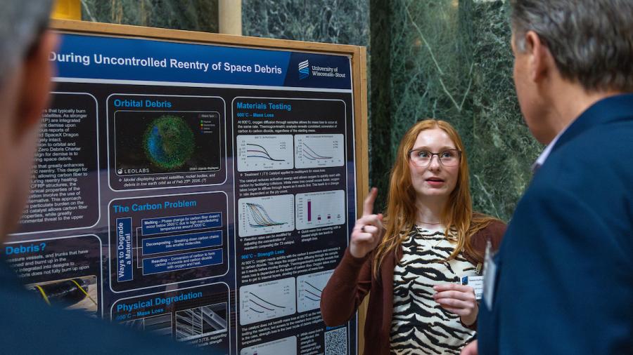 Woman in front of research poster