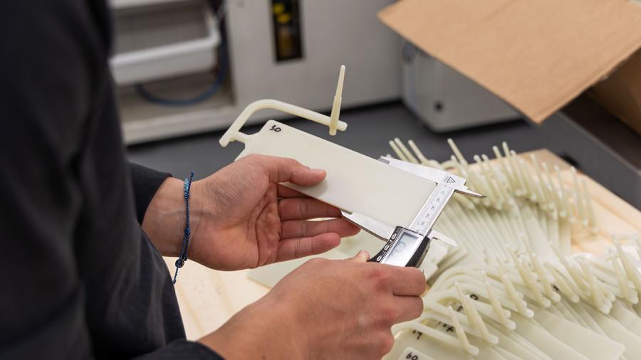 Close of up plastic sample and measuring tool