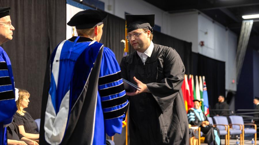 Man receiving diploma