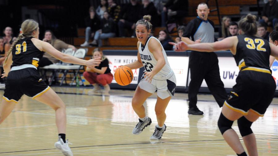 Women playing basketball
