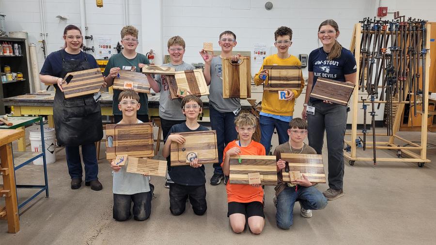 STEAM Construction campers and instructors posing with final projects