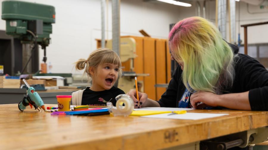 Engineering students designing manufacturable toy prototypes with kindergartners