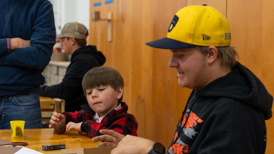 Engineering students designing manufacturable toys with kindergartners