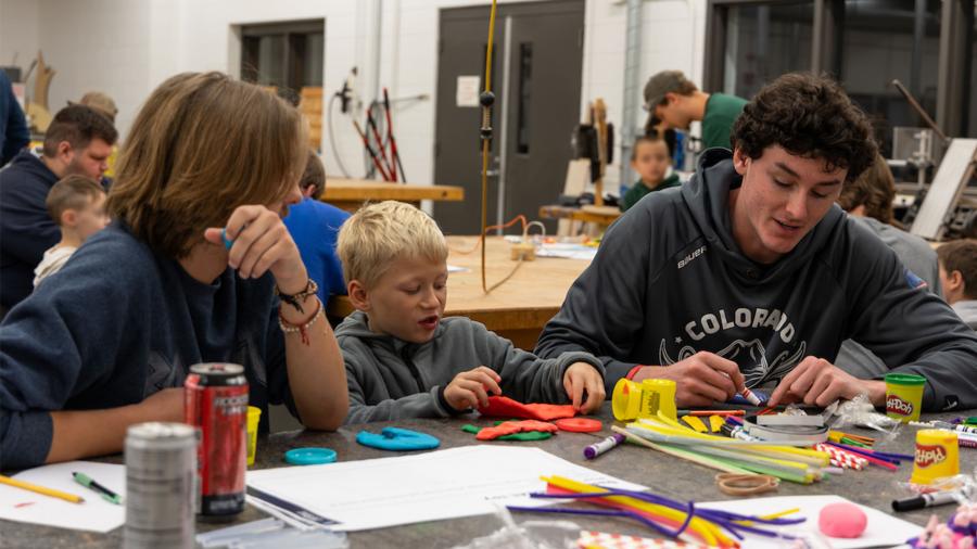 Engineering students designing manufacturable toys with kindergartners