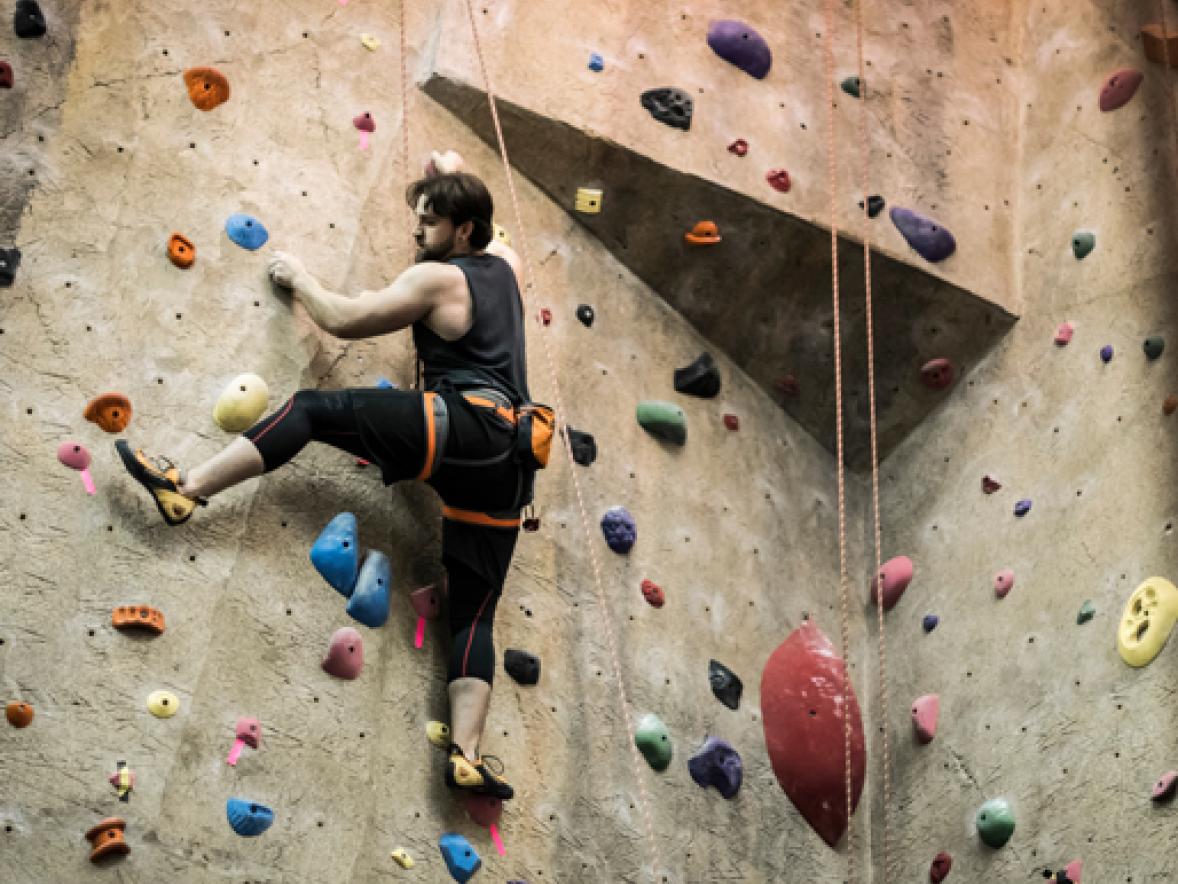 A UW-Stout student goes up the Stout Adventures climbing wall.