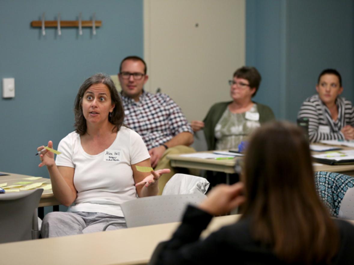 Staff member Alex Hall, left, talks during the Engagement Sessions on campus Monday, Aug. 28.