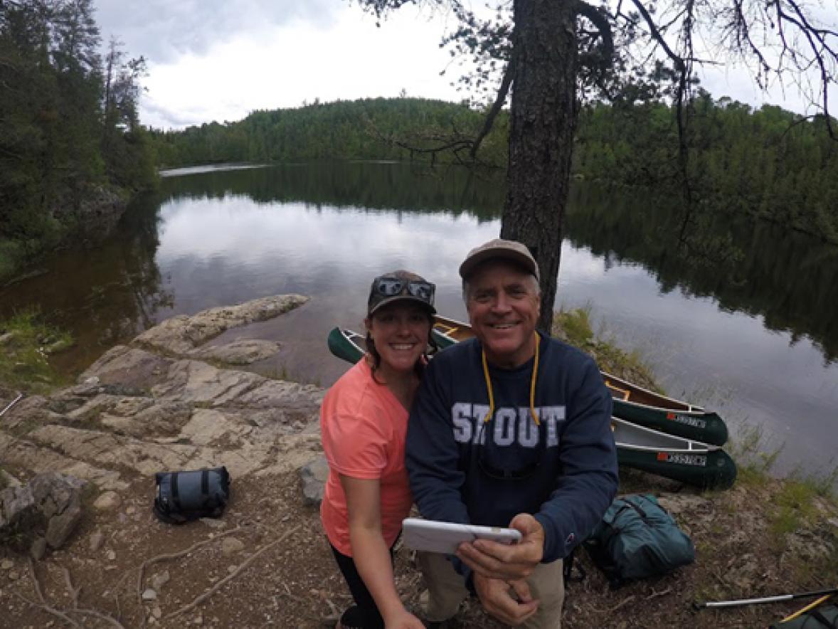 UW-Stout Chancellor Bob Meyer and his daughter, Erica, stop at a campsite in Quetico Provincial Park in Canada during a summer wilderness canoeing trip.