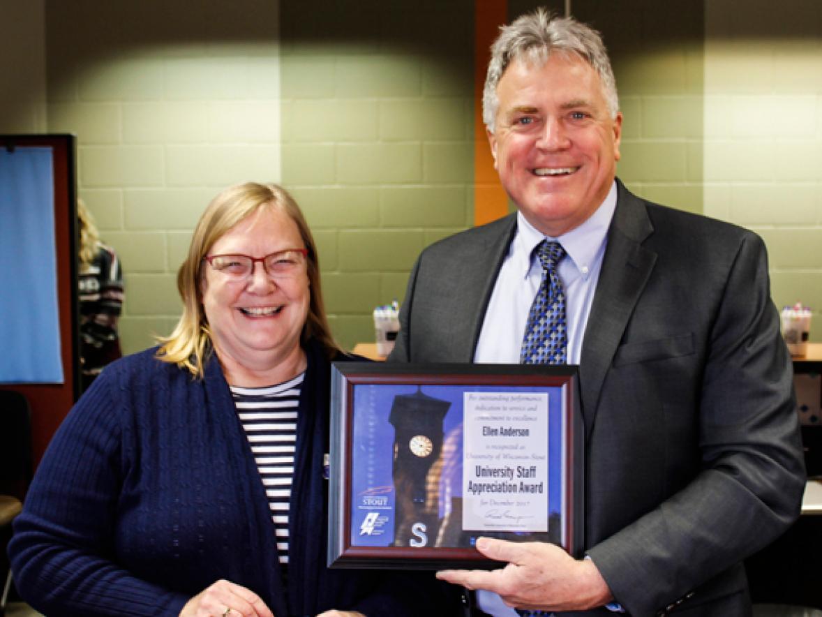 Ellen Anderson receives the University Staff Employee Appreciation Award for December from Chancellor Bob Meyer.