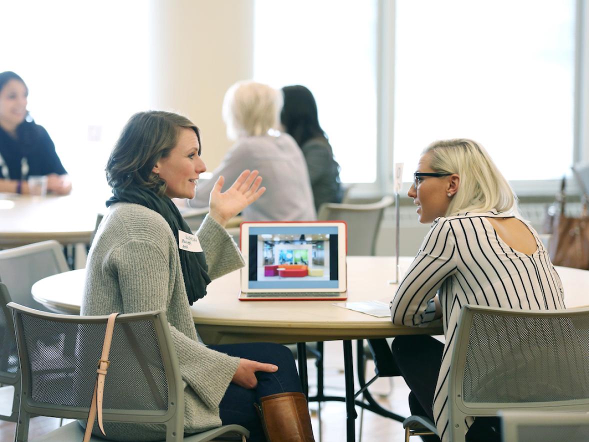 Design student talking with an industry professional in the MSC Ballrooms