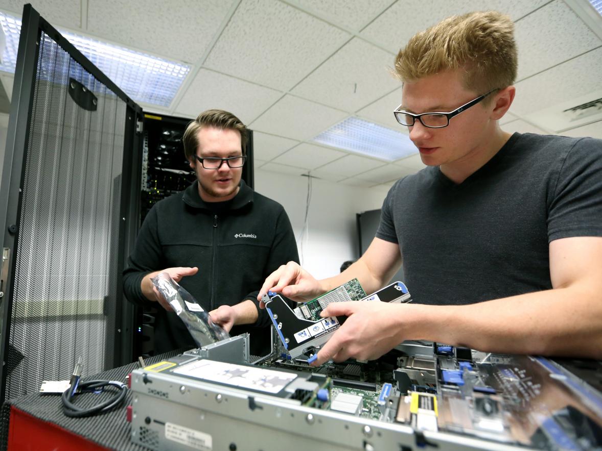 Students work in a computer networking lab.