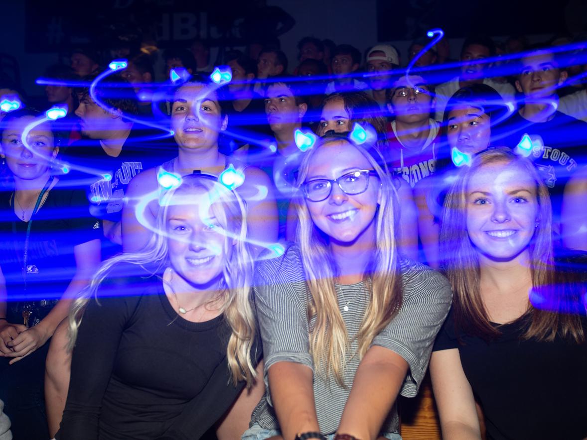 Blue lights swirl around students Sept. 1 during the Blue Rah celebration at UW-Stout to welcome first-year students to campus.