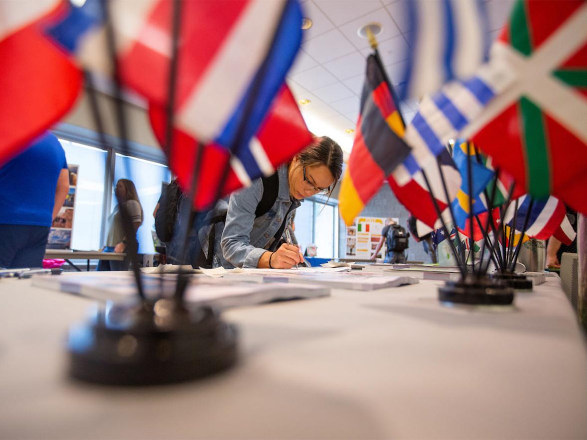 Student registering at UW-Stout's Study Abroad Fair, September 2019.